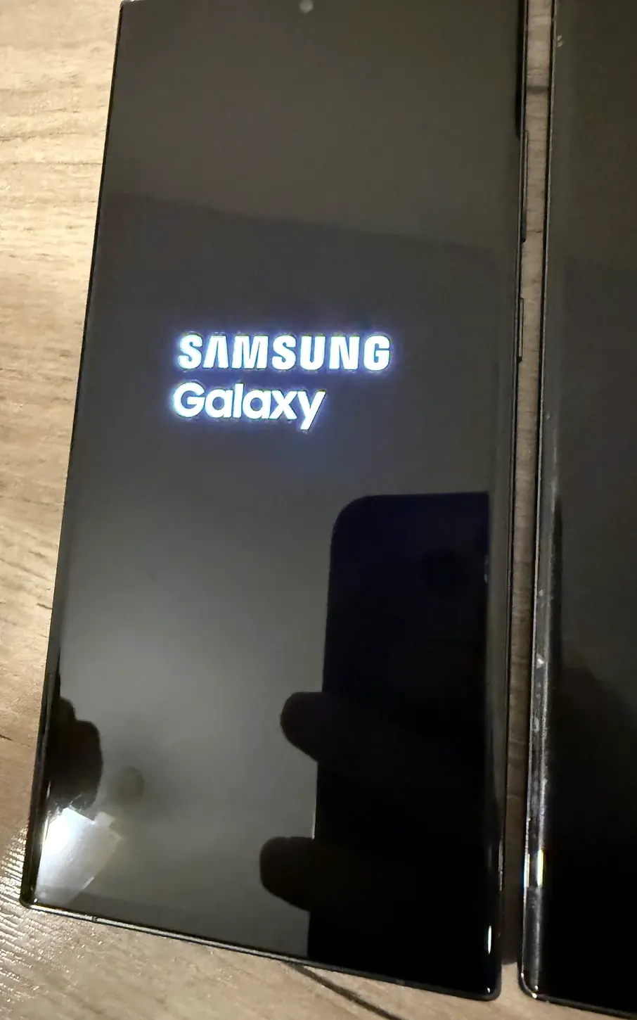 Close-up of a Samsung Galaxy S23 Ultra displaying the Samsung Galaxy startup screen